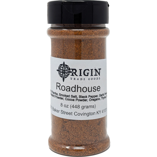 A 6 oz jar of Origin Trade Goods Roadhouse Spice Blend, a bold and savory blend that goes well on almost anything.